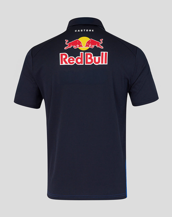 Back view of navy Red Bull Racing polo with a large Red Bull logo on the upper back and Castore branding