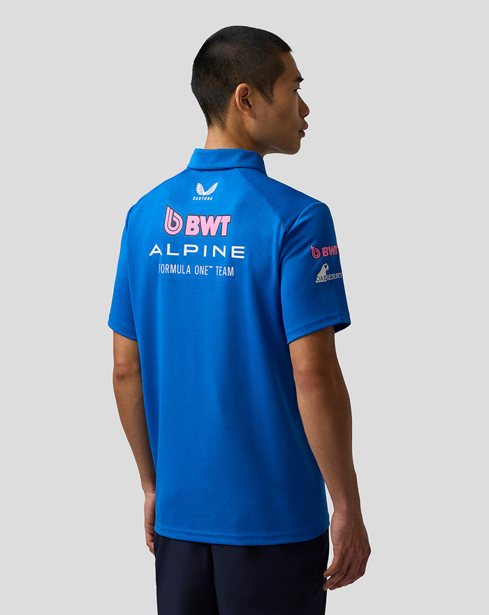 Back view of blue BWT Alpine Formula One Team Polo Shirt on a model with large back sponsor logos.