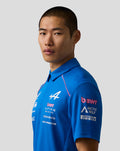 Close-up side profile of a male model wearing the Official Men’s BWT Alpine Formula One Team Polo Shirt in blue.