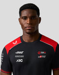Male model wearing Official Haas Team Men's Driver T Shirt black with red shoulder panels and front sponsor logos