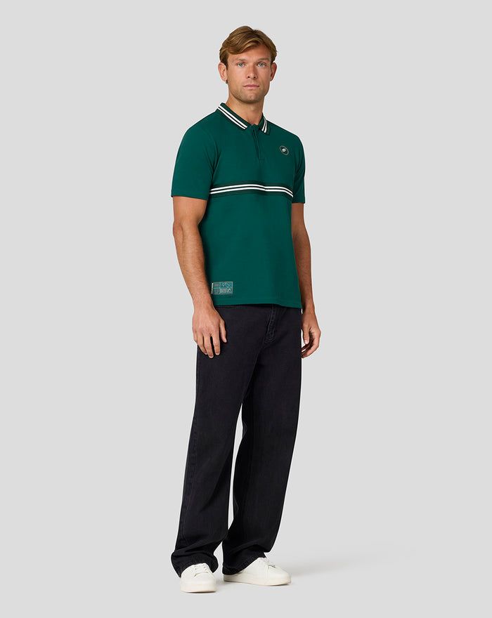 Rear view of male model in Rainforest green Heritage Polo with striped collar