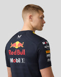 Back view of a model in night sky navy Set Up T Shirt with a prominent Red Bull logo across the back and sponsor logos on the sleeves.