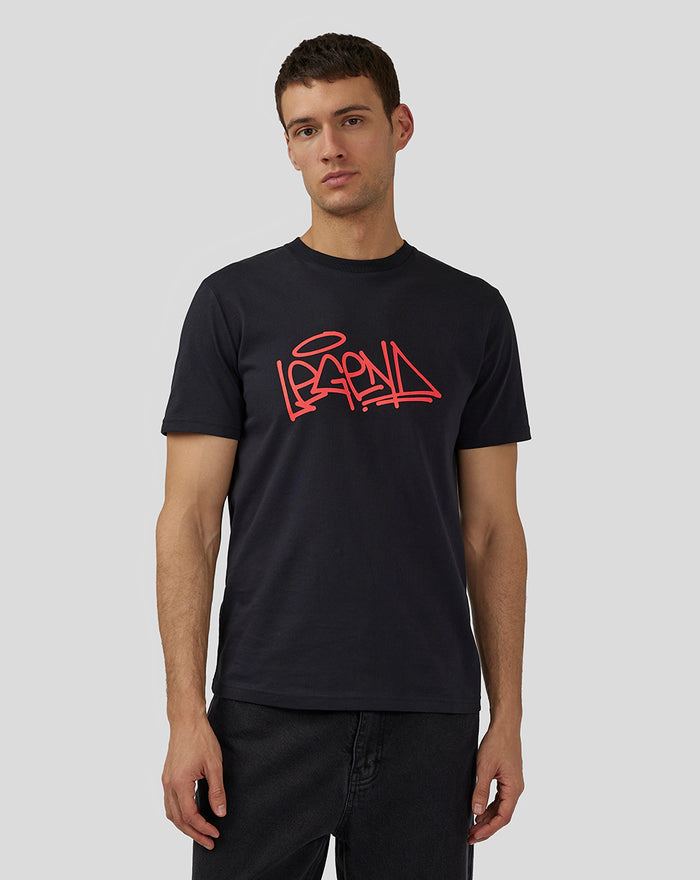 Front view of a male model wearing a black Unisex Silverstone Legend T-Shirt with a red graffiti logo on the chest.