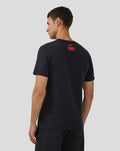 Back view of a man wearing a black Unisex Silverstone Legend T-Shirt with a small red logo on the upper back.
