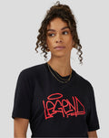 Model wearing unisex Silverstone Legend T-Shirt in anthracite with a red graffiti logo on the chest.