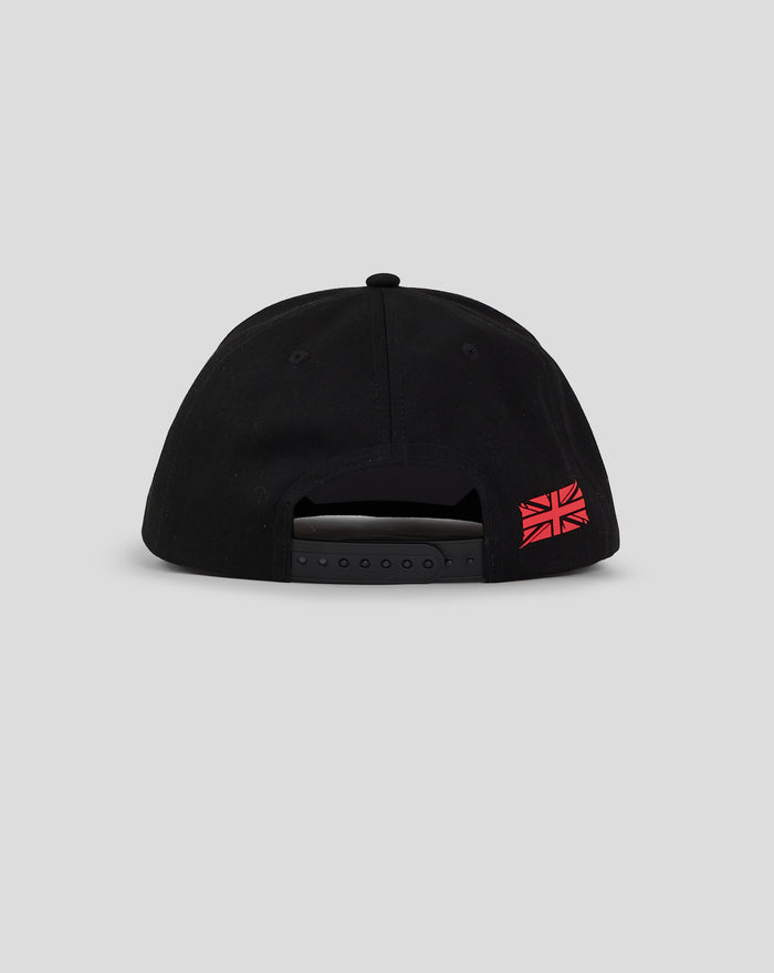 Back view of black unisex cap with an adjustable strap and a red Union Jack patch.