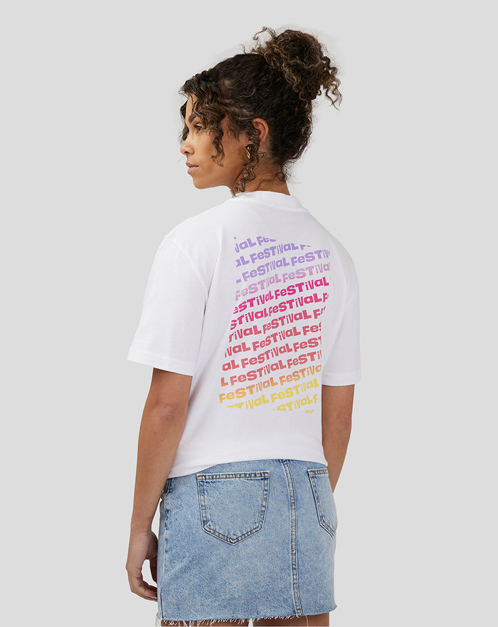 Back view of white unisex Silverstone x Castore Festival Graphic T-Shirt showing rainbow text graphic on the upper back