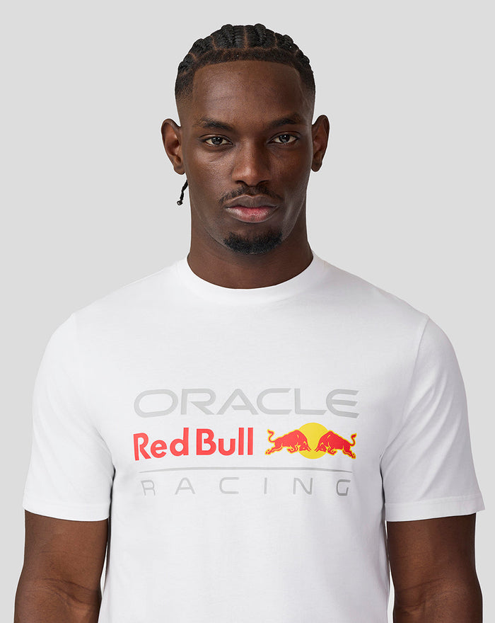 Front view of a male model wearing a white Oracle Red Bull Racing T-shirt with a large front logo.
