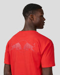 Back view of a model wearing a flame scarlet oversized Oracle Red Bull Racing T shirt with a large back logo