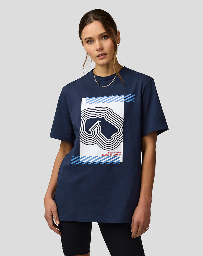 Model wearing Silverstone Core Track Graphic T-Shirt in Black Iris with a large white graphic and blue striped accents on the chest