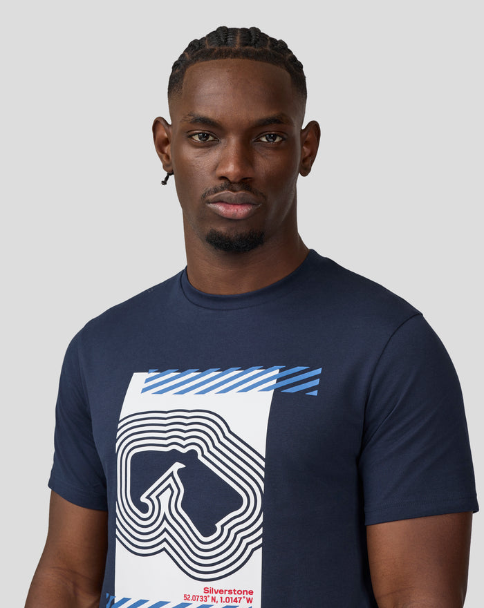 Front view of a man wearing a navy Core Track Graphic T-Shirt with a large white graphic and blue stripes on the chest.