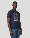 Model wearing navy Silverstone Unisex Core T-Shirt with Union Jack patch on the sleeve.