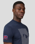 Man facing forward in a navy Silvertone Core T Shirt with a white concentric line graphic on the chest