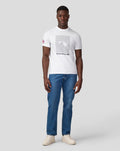 Male model wearing white Silverstone Core T shirt with a large graphic on the chest and a Union Jack patch on the left sleeve