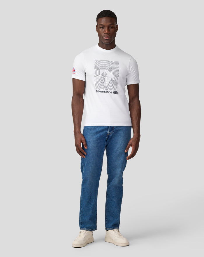 Male model wearing white Silverstone Core T shirt with a large graphic on the chest and a Union Jack patch on the left sleeve