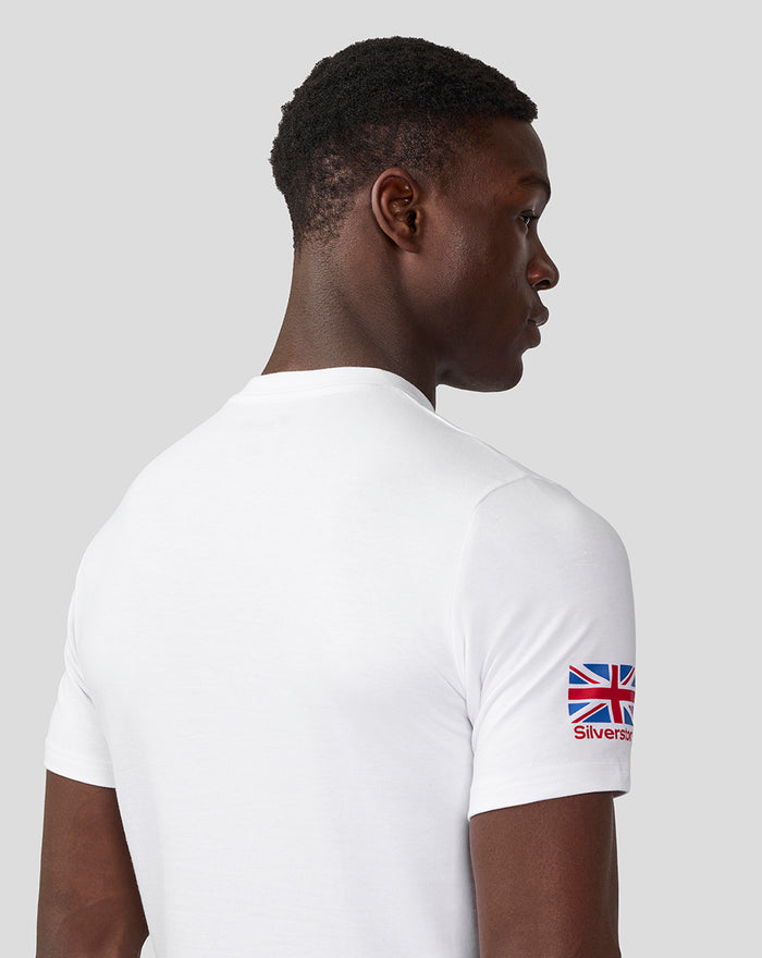 Side view of model wearing white Silverstone Core T-Shirt with Union Jack patch on the sleeve