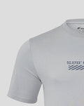 Close up of upper chest and neck area showing the front print on the light gray Core T Shirt