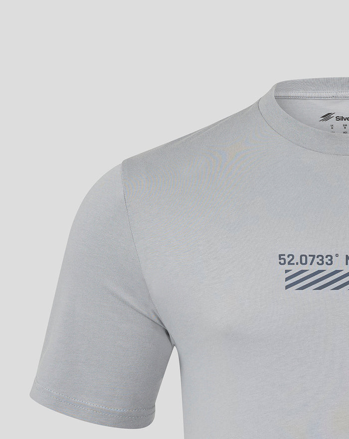 Close up of upper chest and neck area showing the front print on the light gray Core T Shirt