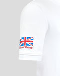 Sleeve close up showing Union Jack patch and Silverstone logo on white polo