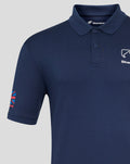 Close up of navy Silverstone Core polo showing collar, button placket, and white chest logo with a partial colorful sleeve graphic