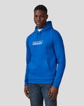 Male model wearing blue Silverstone Unisex Core Hoodie with front pocket