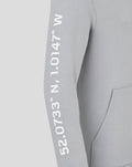 Left sleeve displays vertical white coordinate numbers on a light grey Silverstone hoodie