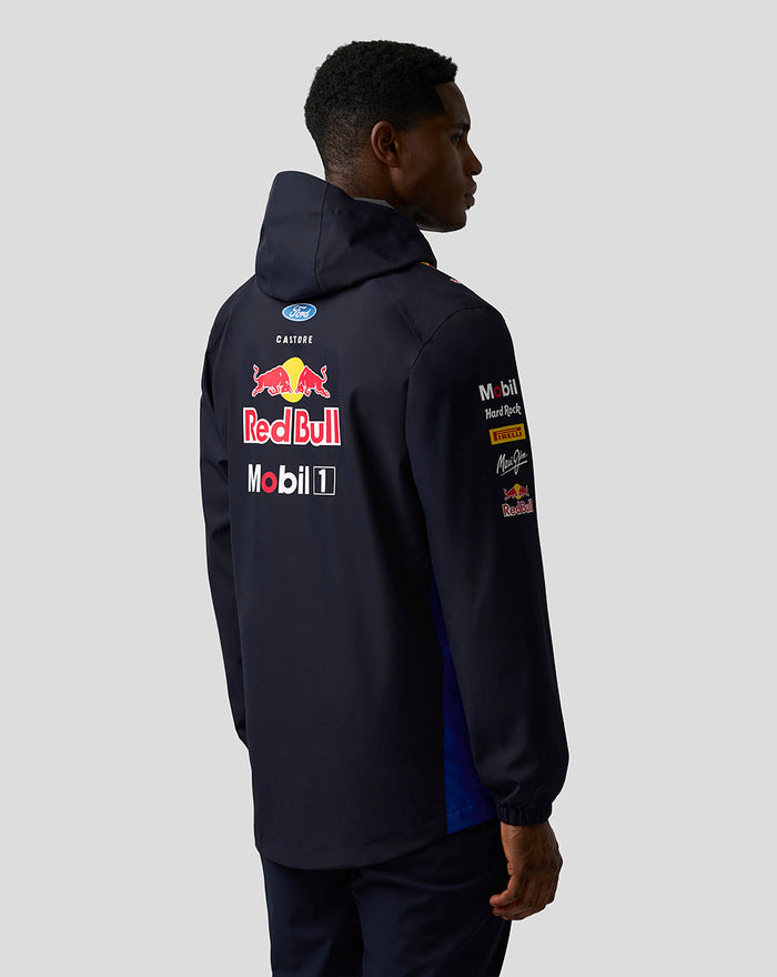 Back view of a navy Oracle Red Bull Racing Teamline water resistant jacket with a hood and large Red Bull logo on the back