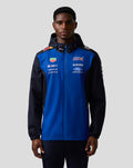Male model wearing blue and navy Oracle Red Bull Racing Teamline Water Resistant Jacket with hood