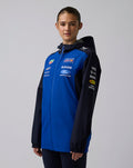 Female model in blue and navy Oracle Red Bull Racing Teamline Water Resistant Jacket with hood and sponsor logos