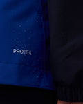 Blue Oracle Red Bull Racing Teamline water resistant jacket close-up highlighting ProTek branding on the fabric