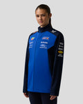 Model wearing Oracle Red Bull Racing Teamline Soft Shell Jacket in Night Sky with navy sleeves and branding on chest and sleeves.