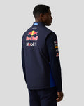 Back view of male model wearing navy Teamline Gilet with large Red Bull and sponsor logos on the back