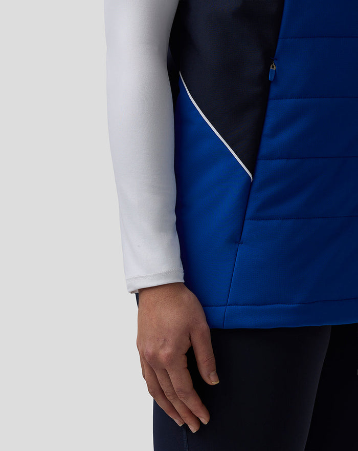 Close up of the blue Teamline Gilet with navy side panels and zip pocket.