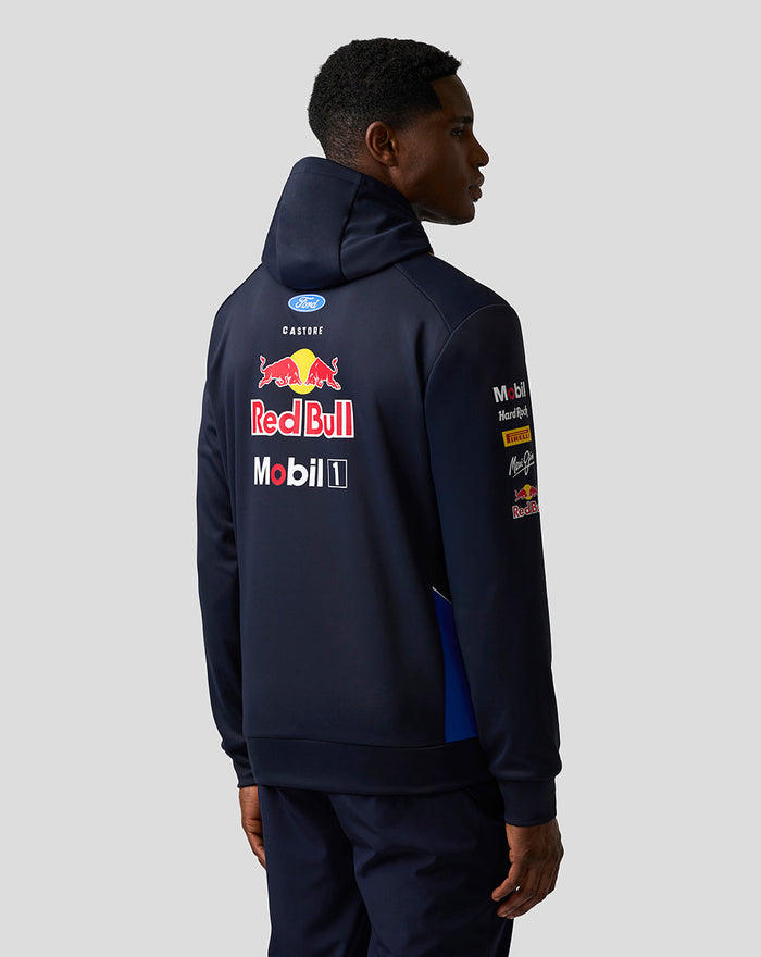 Back view of a model wearing a navy Red Bull Racing Teamline hoodie with large sponsor logos.