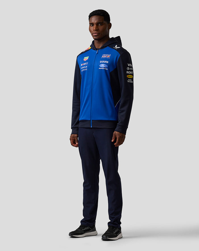 Male model wearing Night Sky blue Oracle Red Bull Racing Teamline full zip hoodie with navy sleeves.