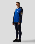 Female model wearing Night Sky blue Oracle Red Bull Racing Teamline full zip hoodie with navy sleeves and hood.