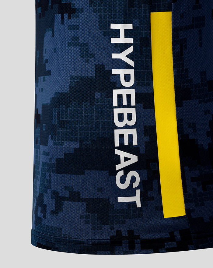 Close up of Oracle Red Bull Racing x Hypebeast Pro Team Kit Track Polo Night Sky showing digital camouflage fabric and a vertical white Hypebeast logo with a yellow stripe.