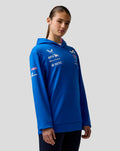 Female model in blue BWT Alpine Formula One Team hoodie shown from the side with chest logos and sleeve branding