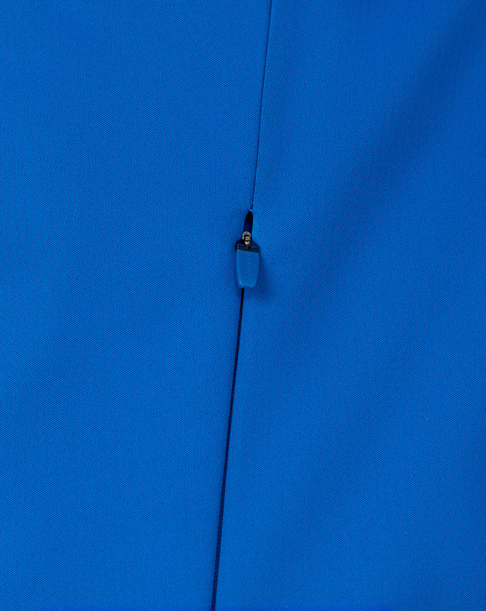Close up of the blue zipper pull and fabric texture on the BWT Alpine jacket