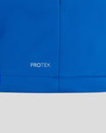 Blue BWT Alpine jacket close up showing PROTEK wordmark at the lower hem.