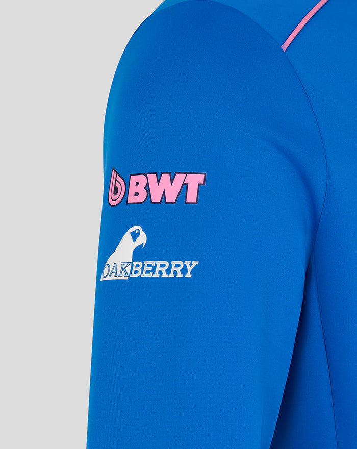 Blue jacket sleeve with pink BWT logo and Oakberry graphic.