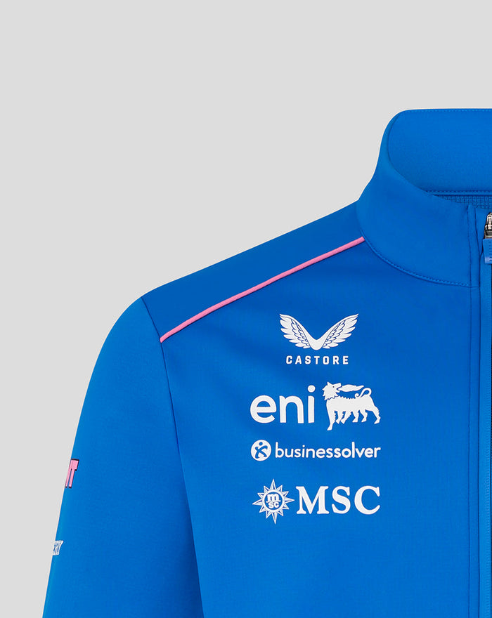 Blue official unisex BWT Alpine soft shell jacket close up of chest logos with pink shoulder piping