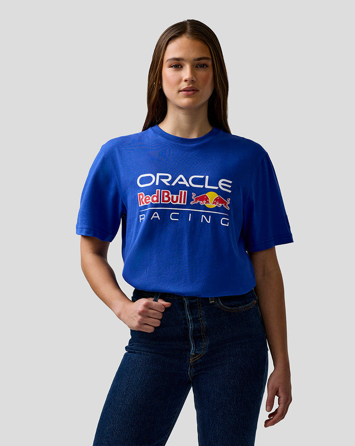 Female model in blue Oracle Red Bull Racing unisex logo t shirt with chest graphic and left sleeve badge.