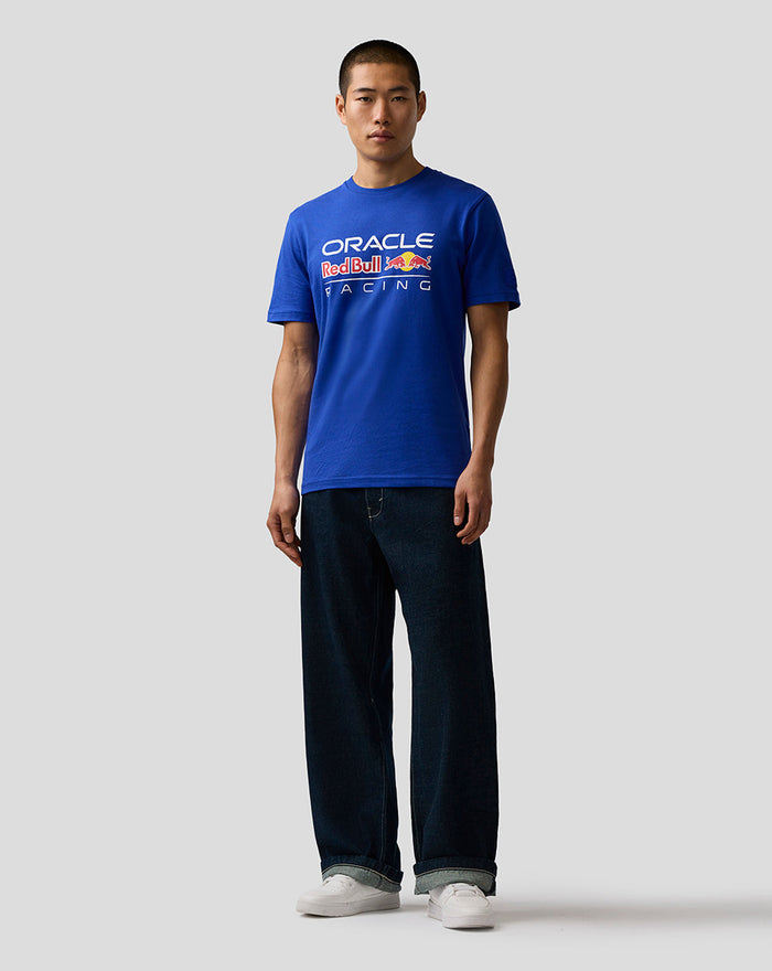 Front view of a man wearing royal blue Oracle Red Bull Racing T shirt with large logo on chest