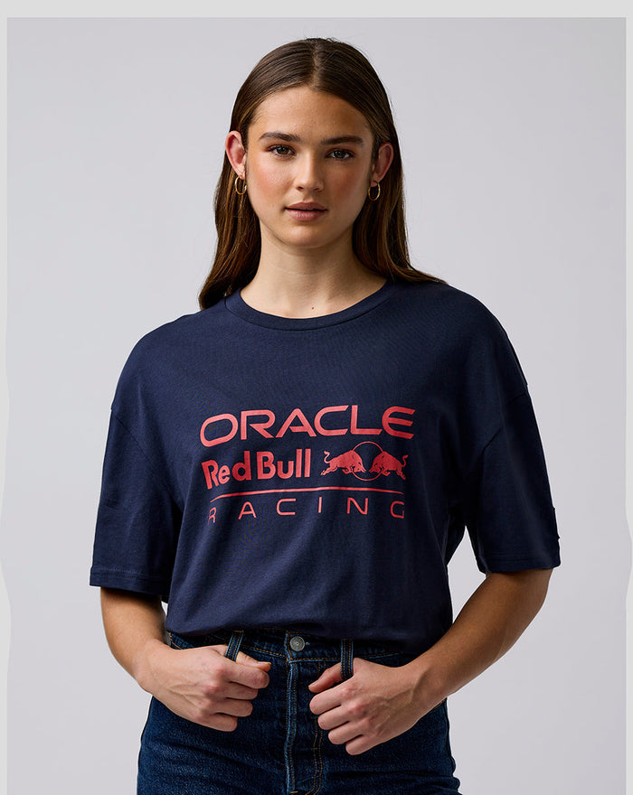 Female model wearing navy Oracle Red Bull Racing T shirt with large red logo on the chest