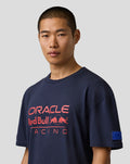 Man wearing navy Oracle Red Bull Racing relaxed fit logo T-shirt with bold chest print and sleeve badge.