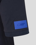 Close-up of sleeve hem showing a blue ORBR patch on the polo sleeve