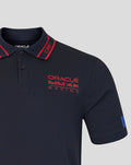 Close up of navy polo showing Oracle Red Bull Racing chest logo and rib striped collar