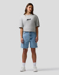 Female model wearing grey marl Max Verstappen T Shirt with a centered MAX logo on the chest.
