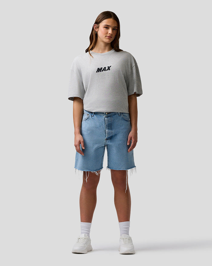 Female model wearing grey marl Max Verstappen T Shirt with a centered MAX logo on the chest.